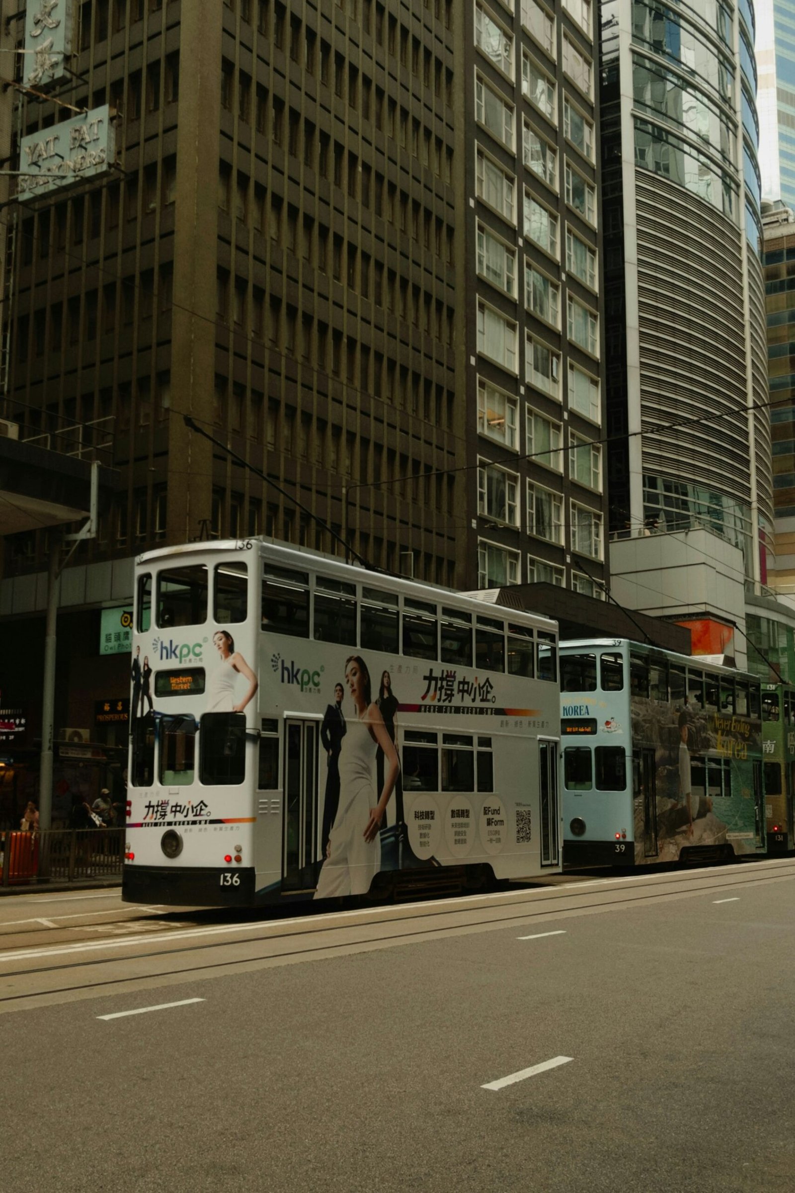 Double-decker trams traveling through Central Hong Kong